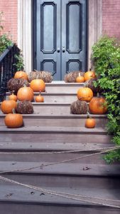 Halloween pumpkins on Greenwich Village brownstone steps. Halloween pumpkins on Greenwich Village brownstone steps.