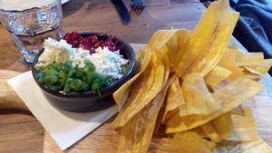 Luxurious guacamole with plantain chips.